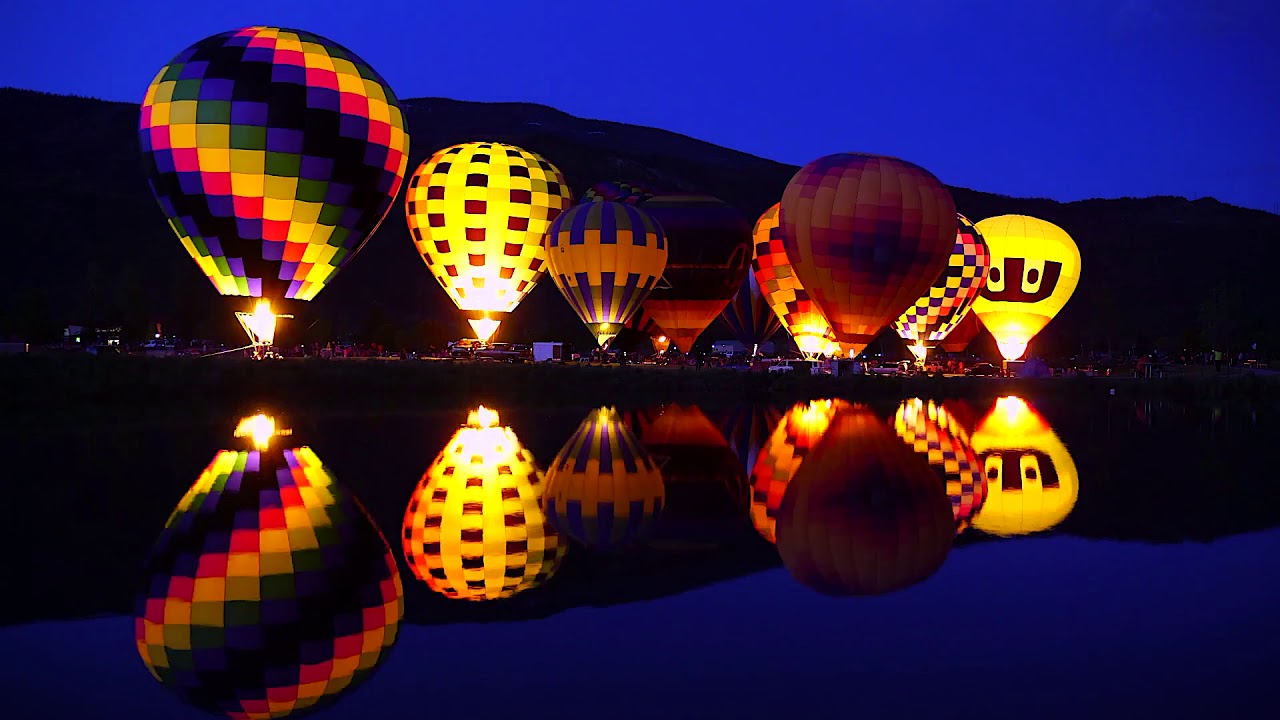 Hot Air Balloon Night Glow Reflected in Lake 