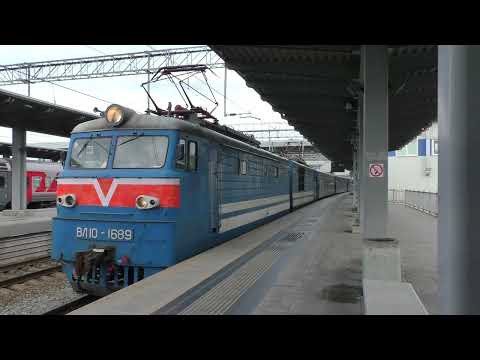 The tourist train Sochi – Gagra is at Adler railway station. Electric locomotive VL10