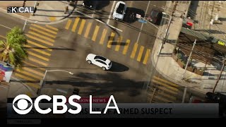 Police pursue possible armed suspect through West LA and San Fernando Valley