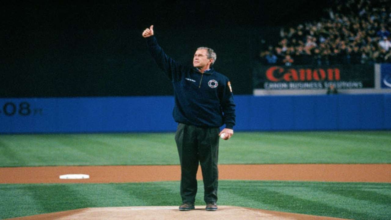 George W. Bush has a little bounce as he throws ceremonial first ...