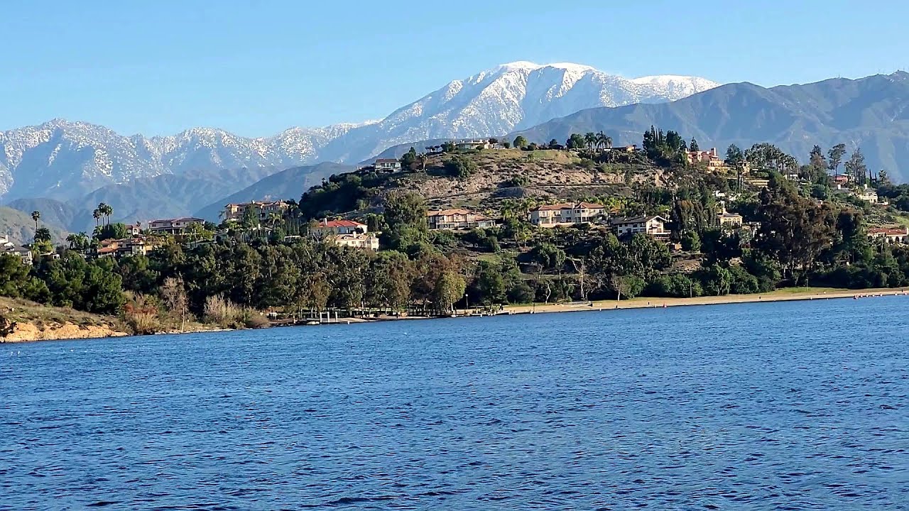 Stunning view of snow capped Mt Baldy from Puddingstone Lake in San