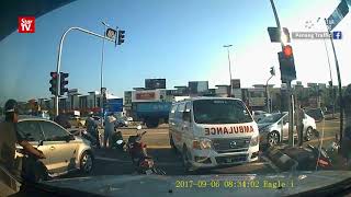 Ambulance struck by car, rams into motorcyclists
