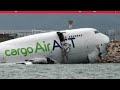 A cargo aircraft skids off a Hong Kong runway into the sea, killing 2 airport workers