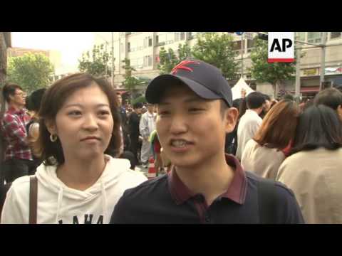 Thousands perform South Korean rapper Psys horse dance during a street festival