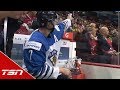 Finnish player signs autograph for canadian fan while serving a penalty