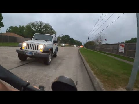 Jeep driver swerves wrong-way into path of bicyclist near Houston