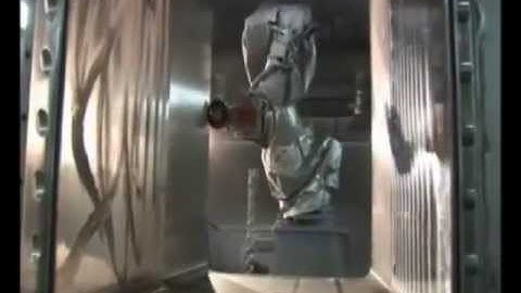 Motoman robot grinding and polishing an autoclave