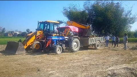 JCB 3DX Backhoe Machine Loading Soil in Sonalika DI-35, Powertrac 439 Plus and Eicher 380 Tractor
