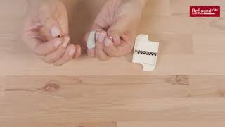 Insert and remove wax filter in RIE hearing aids