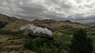 Hogwarts Express crosses the Glenfinnan Viaduct (The Jacobite Steam Train) in Scotland