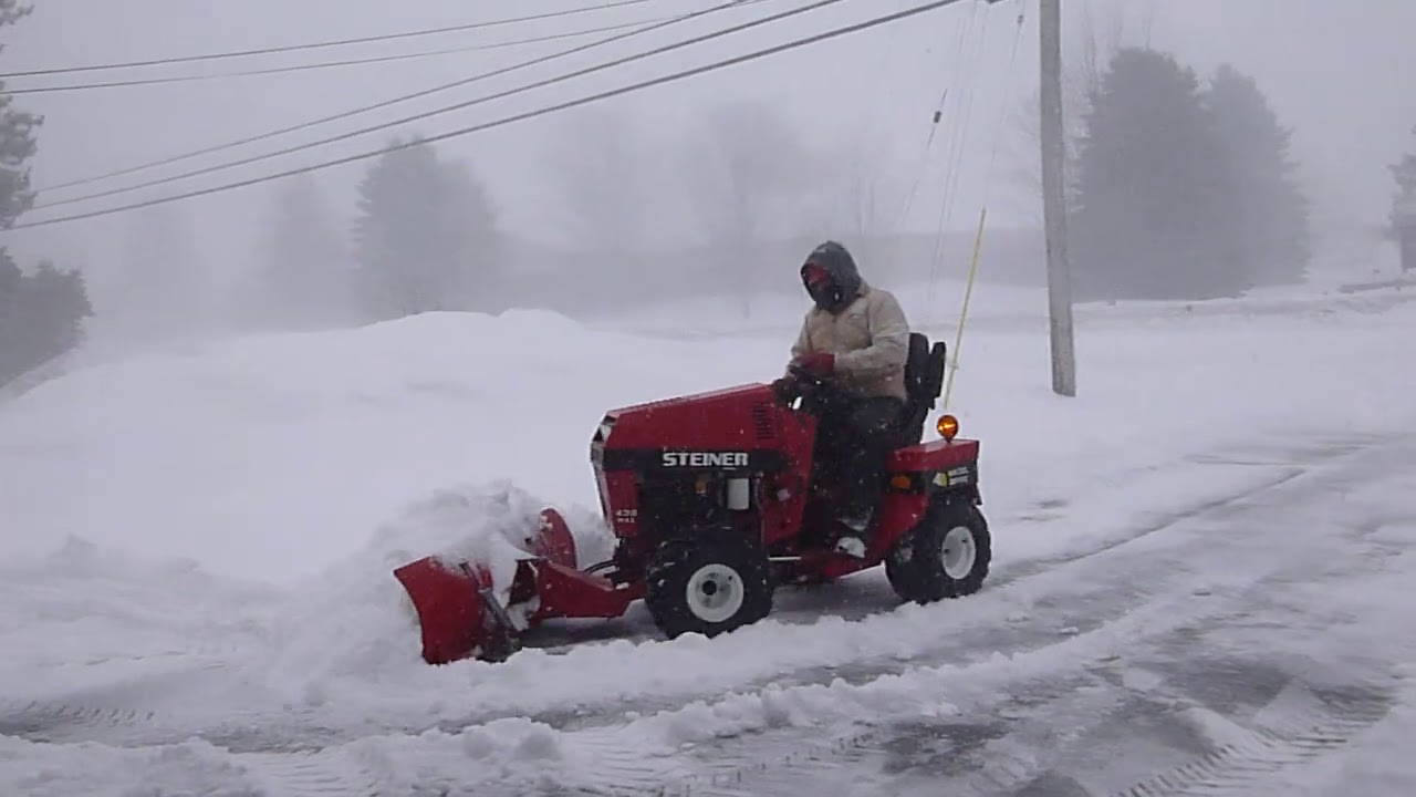 STEINER 430 MAX ARTICULATING 4X4 TRACTOR. Pushing deep snow in Otsego County, Northern Michigan