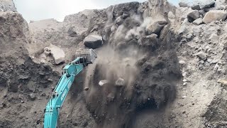 Mining sand on rocky cliffs