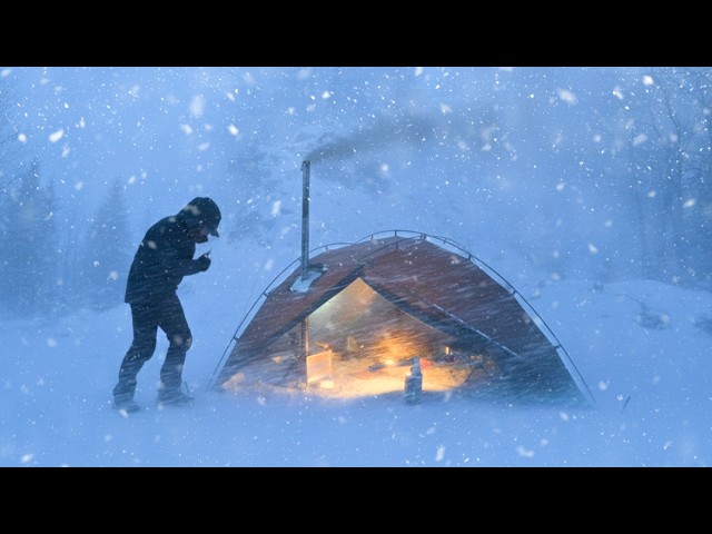 Heated tent in a snowstorm - YouTube