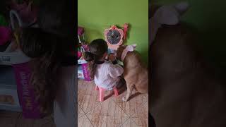 Young Girl Bonding With a Dog While Singing and Doing Makeup