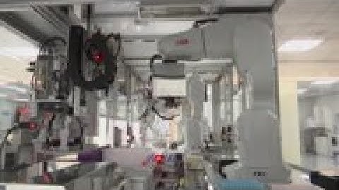 Robot arms perform tests to detect COVID-19