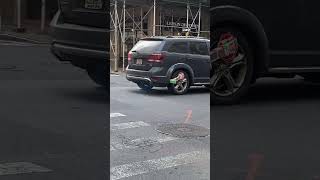 NYC driver causes a scene loudly driving around with boot lock on vehicle tire