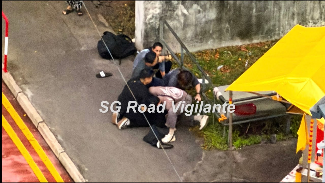 3nov2025  beo crescent carpark entrance  man arrested and handcuffed by officers after a scuffle