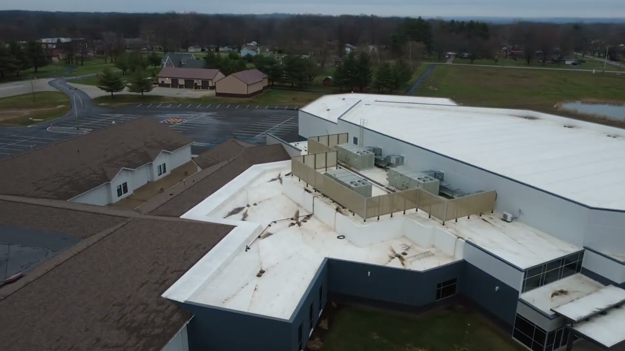 Breathtaking Aerial Views: Church & Countryside in Daylight