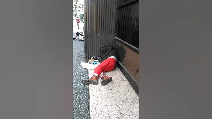 A drunk man on fifth ave all passed out in the mid...
