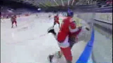 Nic Kerdiles checked from behind by Libor Sulak
