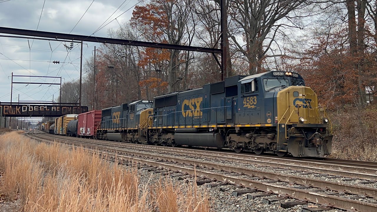 Double headed Mac engines rolling through Woodbourne PA. 