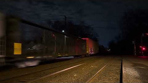 CSX 5282 ES40DC leads CSX M409 through Piscataway with a friendly crew 