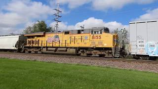 UP 8446 with NS power leads a manifest with UP 8155 as a mid train DPU east in Geneva IL