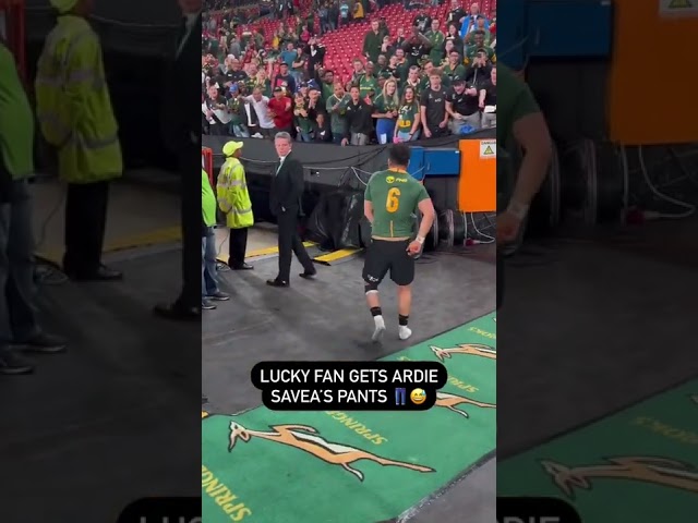 Ardie Savea making a young fans day by giving him his match day shorts. class=