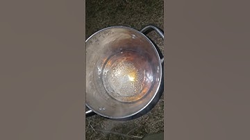 Boiling down 2 gallons of maple sap to make syrup