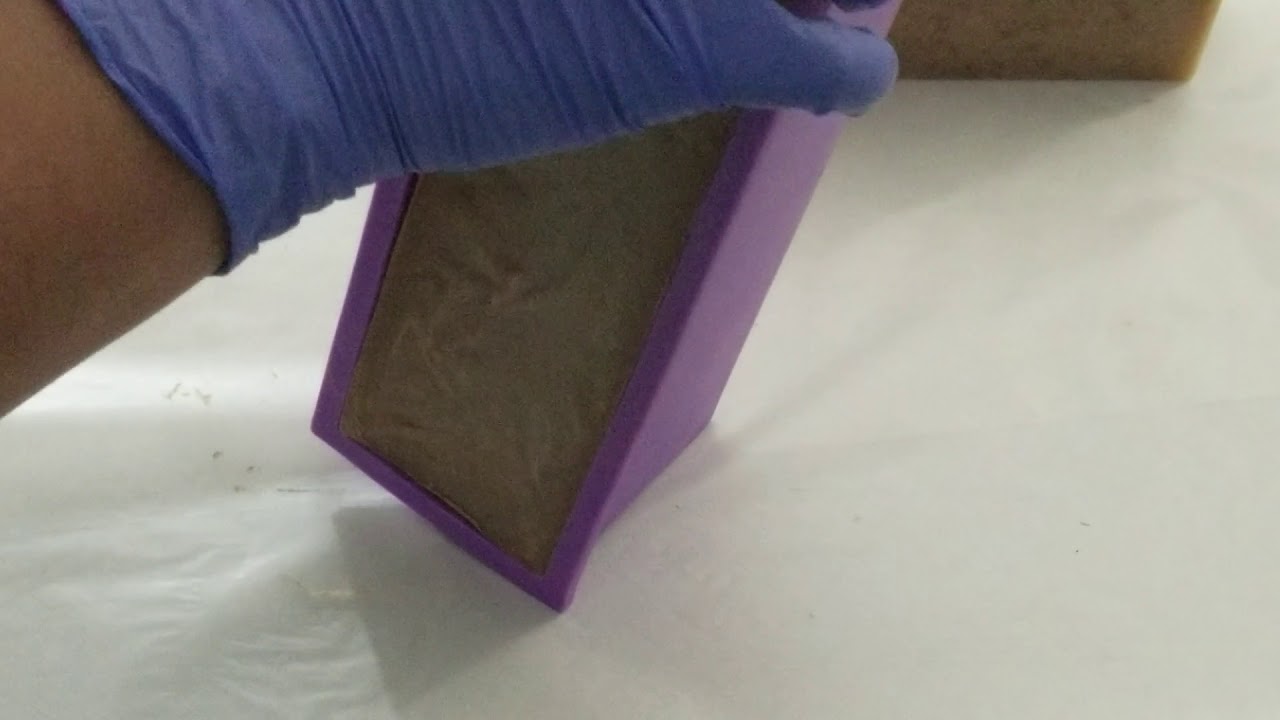 Unmolding handmade coffee soap created in Frederick MD