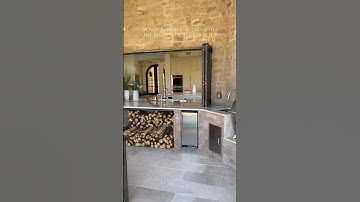 This pass-through window between the indoor & outdoor kitchen is summer entertaining at its finest!