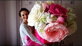 Giant flowers in a hat box. Pleasant trifles