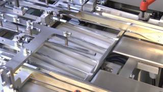 Nrt - Product Overwrapping With Double-Guided Product Elevation