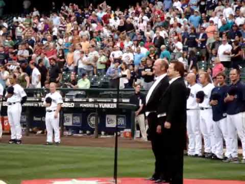 Robert McPherson and John B Cooper sing the National Anthem