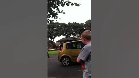 Crazy man throwing tiles at police