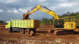CAT 320GX Excavator Loading Ore Nickel On Trucks | Site Project Vale