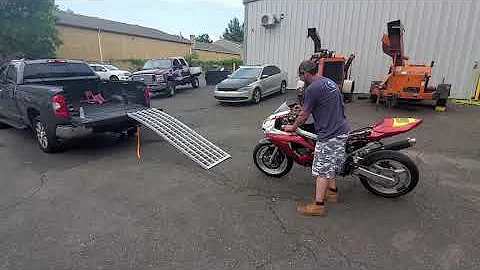 loading and unloading a motorcycle into/from a truck