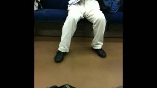 A Guy Shaking His Legs While Reading A Magazine.....