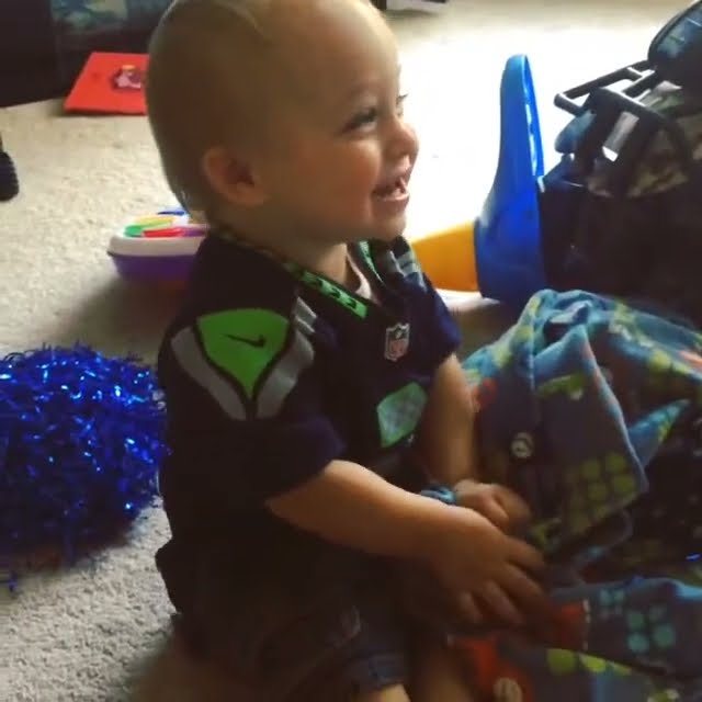 Baby leads SEAHAWKS chant