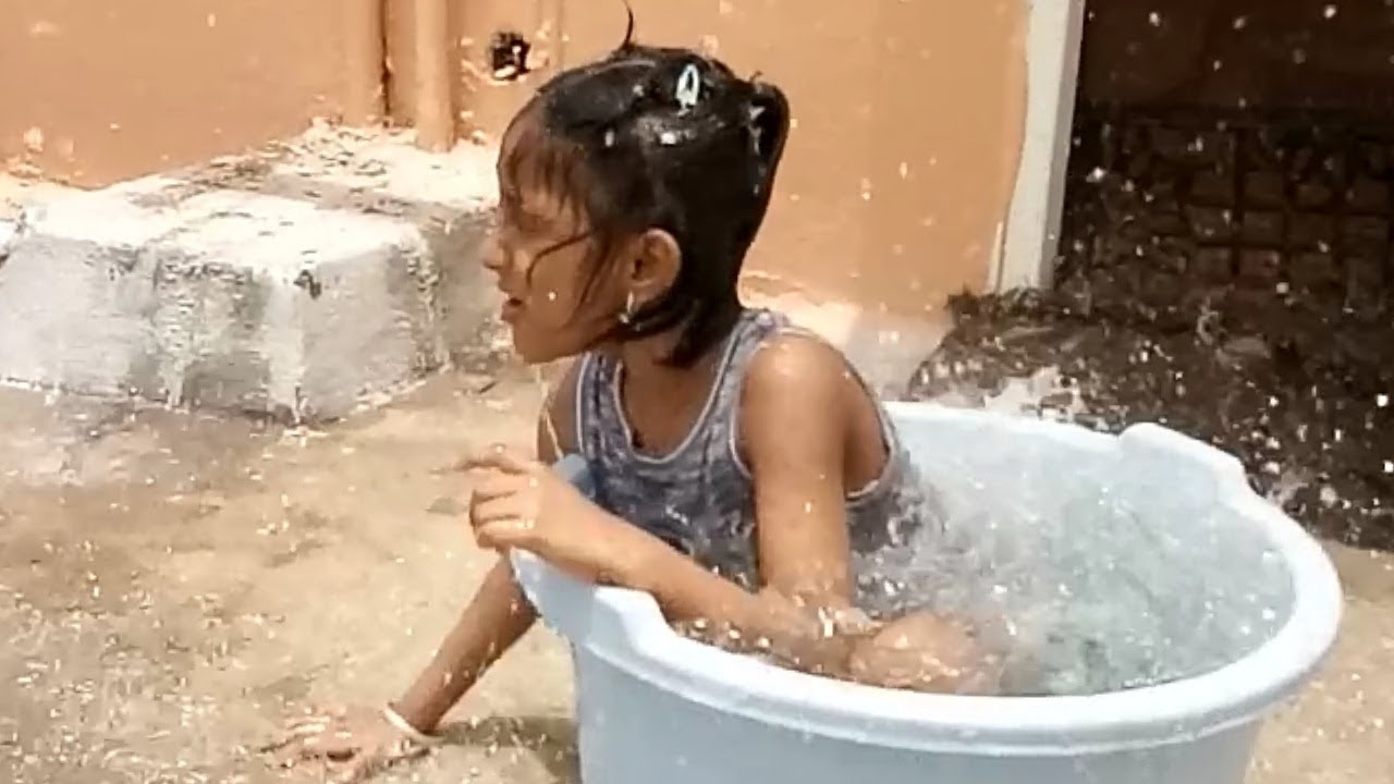 An autistic and cute baby enjoying rain video Adorable Momentsbaby