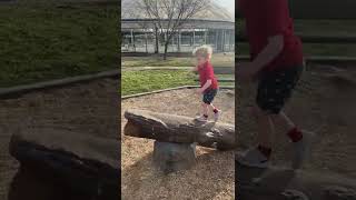 Little boy rumps from over oversized rock and faceplants