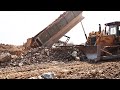 Incredible Bulldozer Dump Truck Moving Soils , Stones Operator / Dump truck spreading dirt
