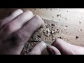 Hand carving the art nouveau style oak wood pendant