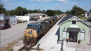 A westbound CSX train with empty grain hoppers on the TP&W Railway in Remington, IN