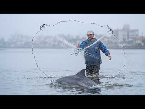 Fishing in Tramandaí with dolphins at the river mouth!!!