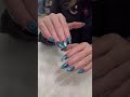 This nail design features a butterfly shape