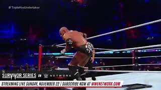 Triple H elbow drops Kane through table