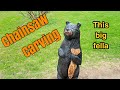 Chainsaw carving this big bear with a fish