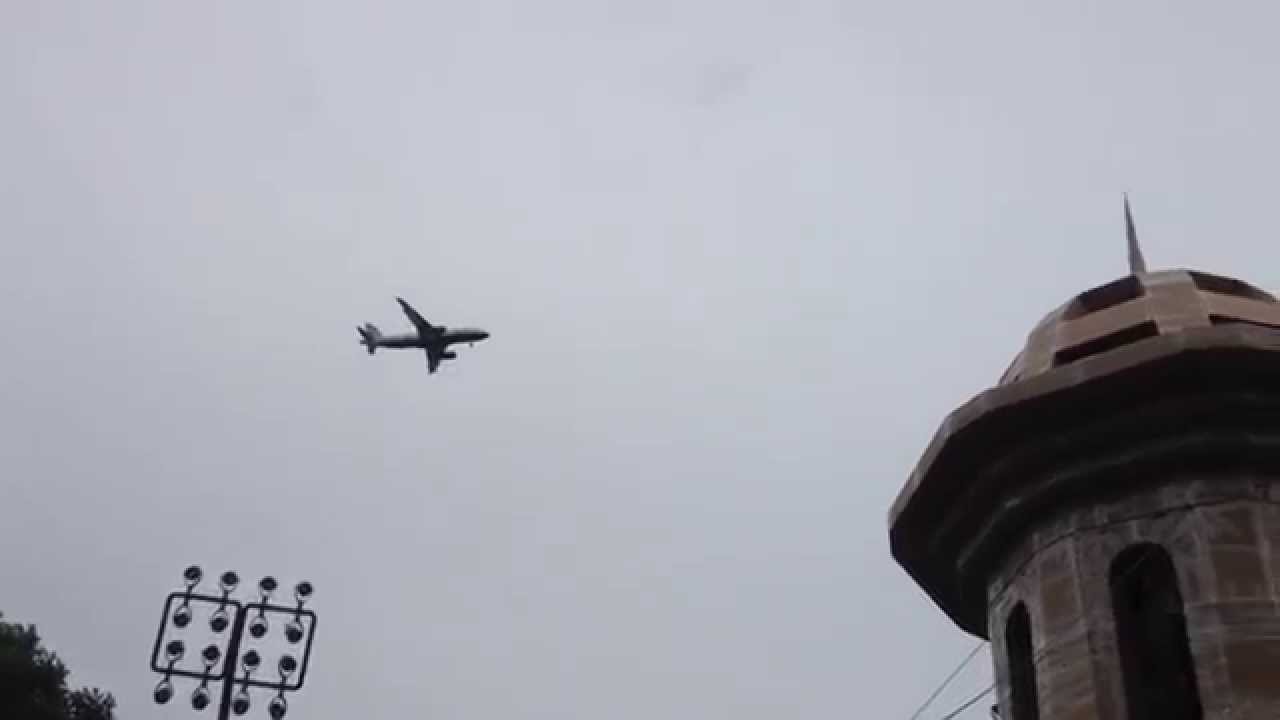 Low flying planes over Hounslow High Street Bell Square Corner towards London Heathrow Airport