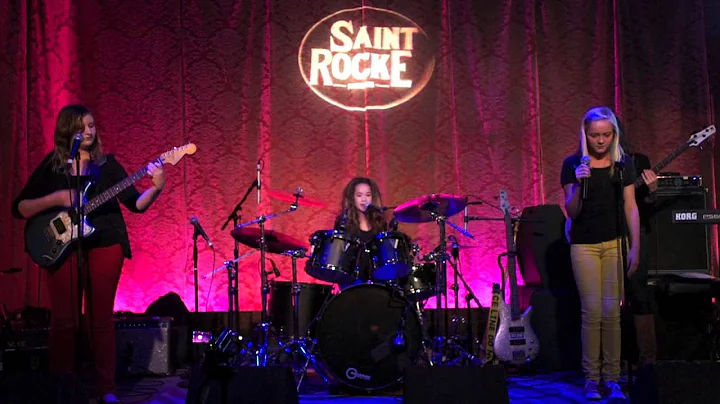 Samantha Downey performing drums and vocals